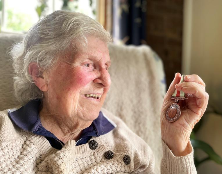  Margaret Elliott, 99, with the Civilian Service Medal she received decades after serving in the Women’s Land Army.