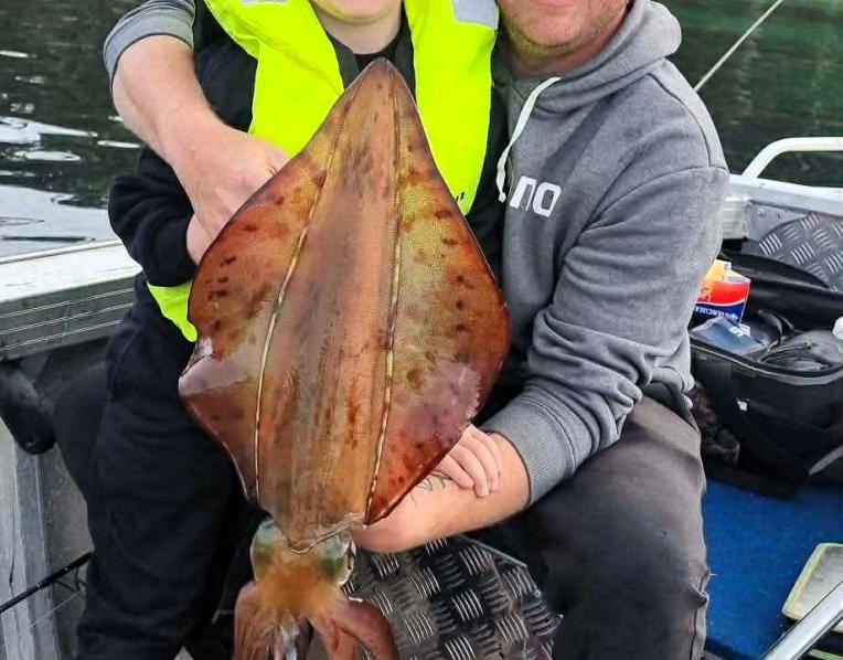 Bailey Withers with his dad Luke and a big Southern Calamari Squid Bailey caught last weekend during the opening of the Squid season /Southern zone.