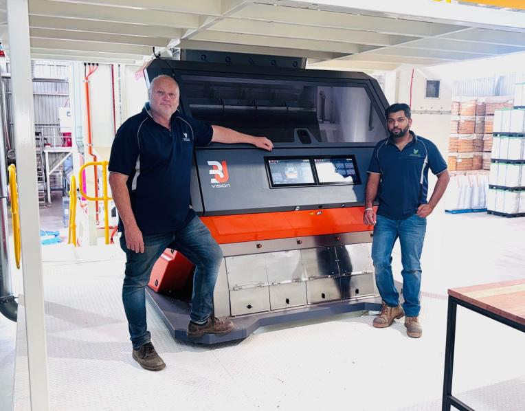 Tasmanian Seed Dressing and Storage general manager Morgan Leath and operations manager Abhi Gupta in front of the 3U Vision Fenix 4