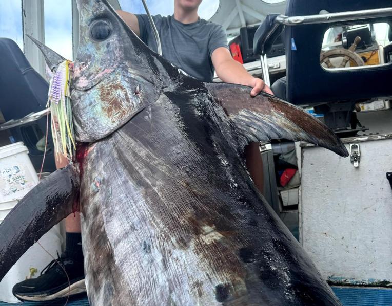 Lochie Miller with his 151kg record-breaking Broadbill Swordfish