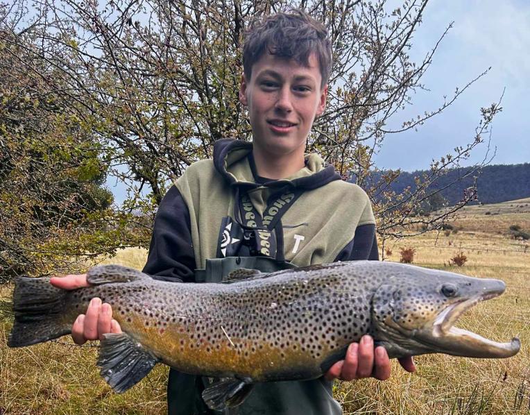 Conna George with the big 5kg buck male brown trout he caught and released last weekend.