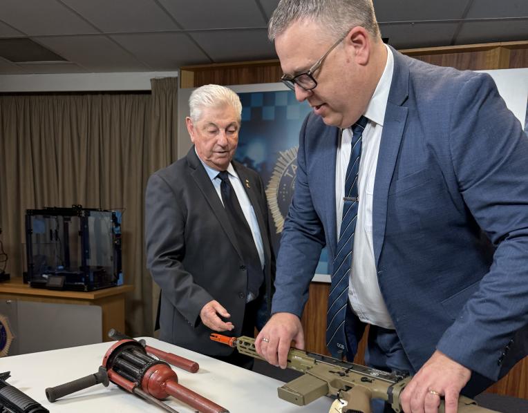 Crime Stoppers Tasmania chair David Daniels and Inspector Troy Morrisby.