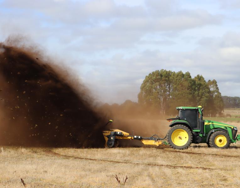 A Wolverine ditcher sends the red soil of Hagley flying