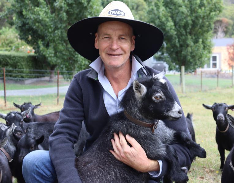 Peter Bultitude surrounded by goats