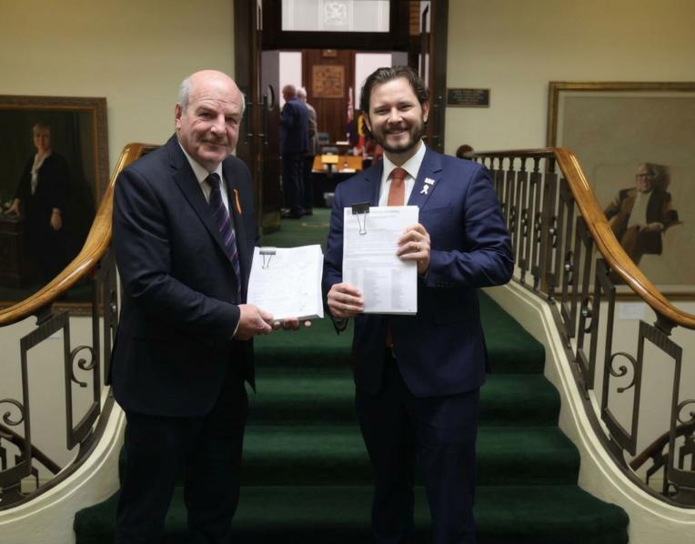 Mark Shelton and Felix Ellis with the petitions