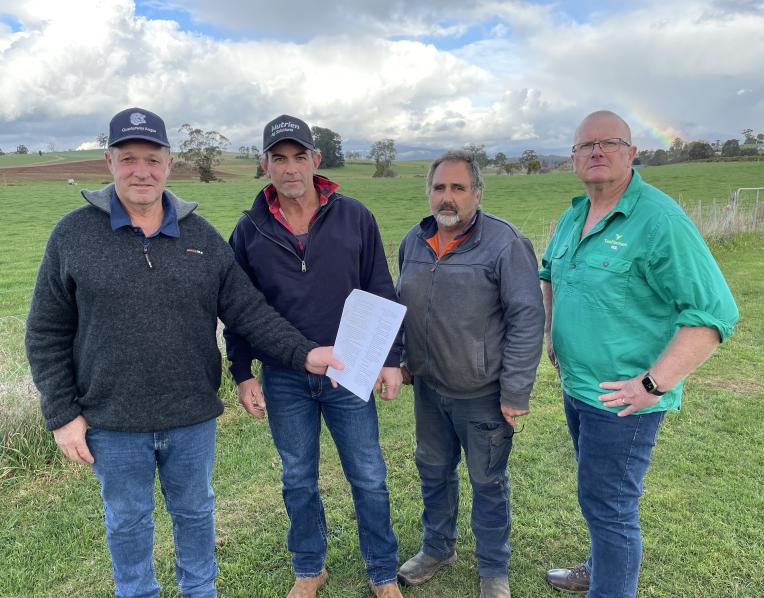 Potato growers Trevor Hall of Scottsdale, Stuart Appleby of Gawler, Ricky Elias of Bishopsbourne and TasFarmers COO Neil Grose with Simplot's rejected contract.