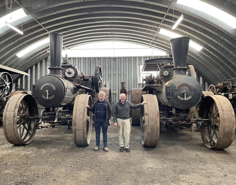 Westbury Preservation Association treasurer Robert Hill, left, and president Brenton Heazlewood with The Lion and The Lioness - a rare pair of Fowler winding engines which have returned to Tasmania this week after a 50-year absence.