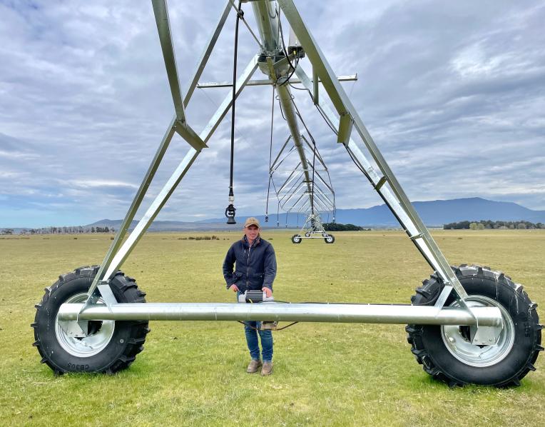Alex Downie with a new pivot irrigator at Fairfield, Epping.