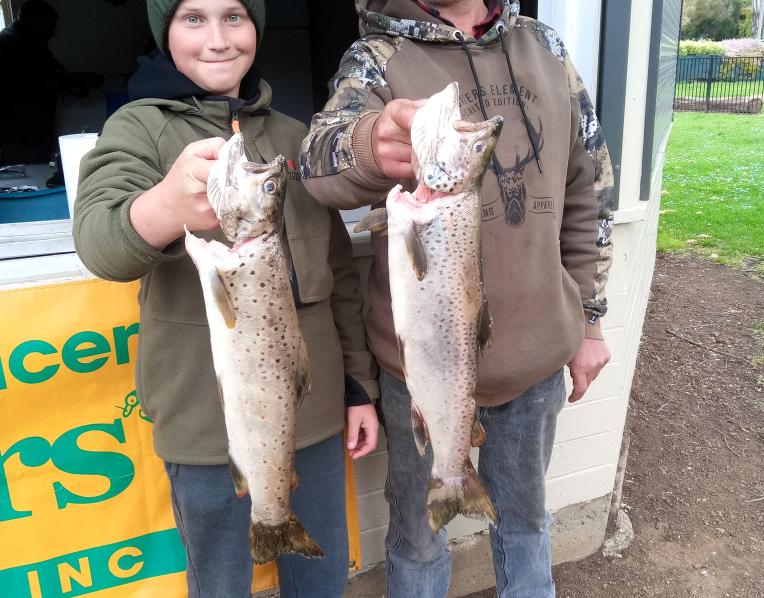 New Norfolk Licensed Anglers Association members Adrian Slater and his son Jayden with their winning catches from last weekend’s Derwent River competition.