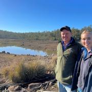 Richard Johnston and daughter Lottie on their Rosevale property where three dams remain close to empty awaiting decent winter rain.