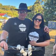 Edan Manley of Slopen Main and Rebecca Smith of Sorell volunteer at the Garlic Festival.