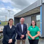 Tasbuilt Homes client liaison manager Fiona Boyer, sales consultant Simon Best and Rural Youth state president Amber Bramich on site at Tasbuilt Homes, Westbury, with Rural Youth’s new headquarters pre-fabricated and ready for delivery to Quercus Park.