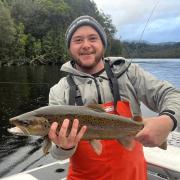 Mark Botha with a healthy brown trout caught from the Gordon River on the West Coast of Tasmania recently