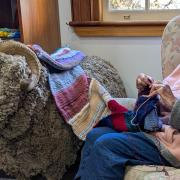 Rosie Dewar of Longford adds some knitting pizazz to the Knit for Jim winter project at the Wool Centre in Ross