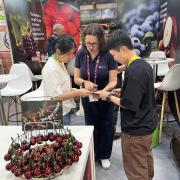 Fruit Growers Tasmania Trade and Marketing Officer Kate Dickinson assisting visitors at this year's Asia Fruit Logistica event