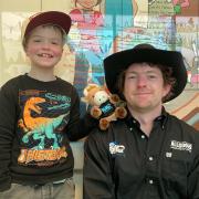 Jacob Hall with bull rider Josh Clark