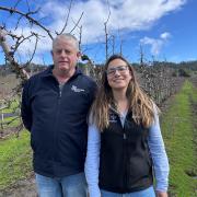 Rodney Hogan of Montague Farms and tree crop physiologist Leticia Reis