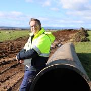  Tasmanian Irrigation CEO Mike Sylvester at a pipe laying site in the Northern Midlands. 