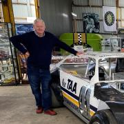 Rob Knott with some of his collection of motorsport memorabilia. 