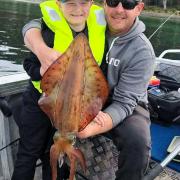 Bailey Withers with his dad Luke and a big Southern Calamari Squid Bailey caught last weekend during the opening of the Squid season /Southern zone.