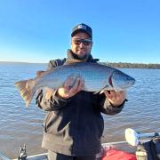 Clinton Cantwell with a solid female brown trout he caught from Lake Crescent last week