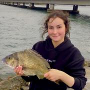16-year-old Treasure Williams with a big Black Bream she caught on bait from Midway Point recently.