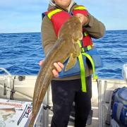 Jayden Slater, 11 with a 70cm Southern Bluespot Flathead he caught off Bridport recently.