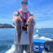Ewan Dillon with two nice flathead he caught recently from Pirates Bay