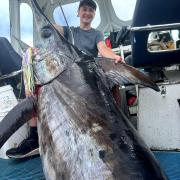 Lochie Miller with his 151kg record-breaking Broadbill Swordfish