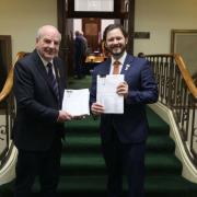 Mark Shelton and Felix Ellis with the petitions