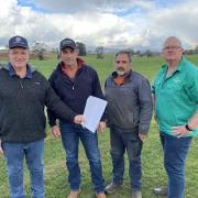Potato growers Trevor Hall of Scottsdale, Stuart Appleby of Gawler, Ricky Elias of Bishopsbourne and TasFarmers COO Neil Grose with Simplot's rejected contract.