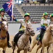 Ruby Atkins leads the Australian team’s victory lap on a one-eyed pinto pony, Woody, who was one of the horses used by teams contesting the 2026 International Mounted Games Exchange title in Kentucky, USA.