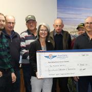 Agricultural Contractors of Tasmania Inc members Daniel French, Ivan French, Roger Fish, Glen McInnes, Phillip Boyd and president Peter Campbell present RFDS Tasmania CEO Nicole Henty with a cheque for $2000.