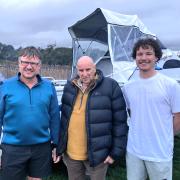 Steve De Bruyn, Pieter De Bruyn and Jak Oxford with the boat they used for a dangerous rescue
