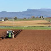 Tractor preparing paddocks near Deloraine
