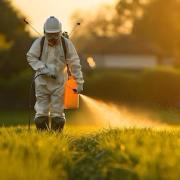 farmer spraying pesticides
