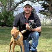 Alex Johns with Cobber Challenge champion Earl and new puppy Joey.
