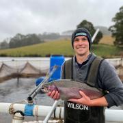  Leigh Atkinson of Atkinson Aquaculture with a trout grown out in a farm dam.
